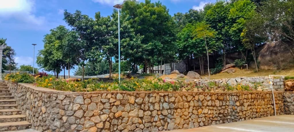 Nairuthya Whispering Wood — Stone Terraces & Boundary Landscaping