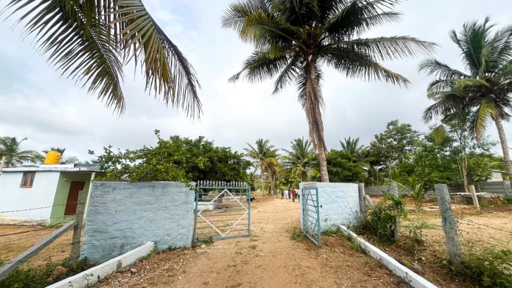 Grand entrance gate and perimeter wall at Coconut Garden in Bidadi